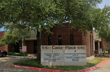The front entrance of Abode Treatment Inc. in Dallas, with a clear sign and a welcoming environment.