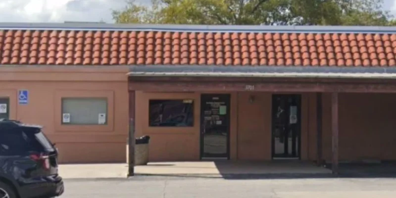 Close-up of front entrance with accessible signs and canopy