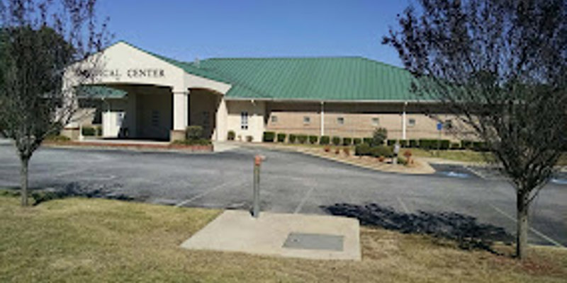 Facility exterior with entrance and accessible parking.