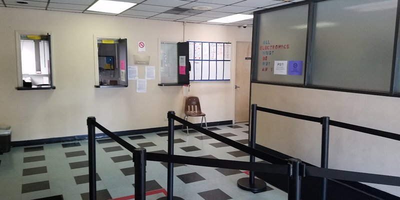 Waiting area with partitions for service windows. 