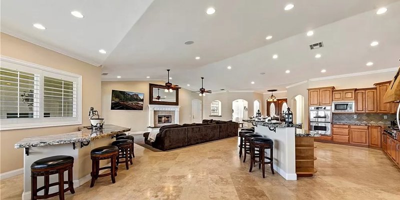 Living area with a fireplace and breakfast bar.