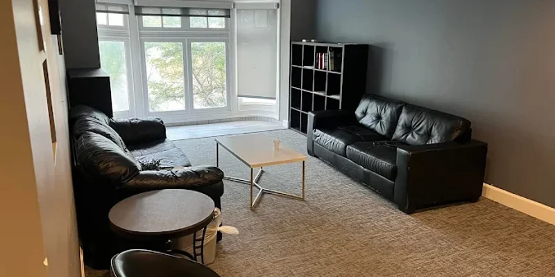 Lounge Area with Sofas and Shelving