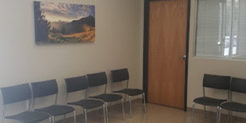 Waiting area with seating along the wall.