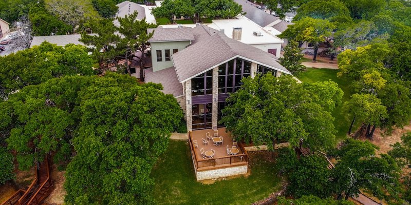 Aerial view of a rehab center among lush green trees