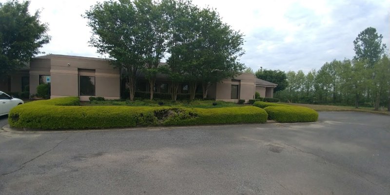 Facility exterior with accessible parking.