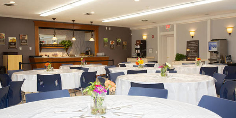 Dining area with a tables and chairs.