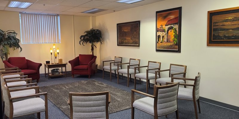 Group therapy room with chairs in a circle.