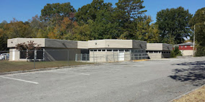 Facility exterior with accessible parking.