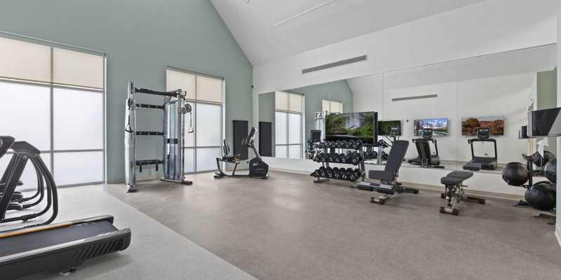 A well-equipped fitness gym with exercise machines.