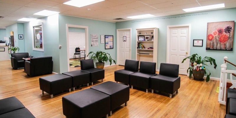 Lounge with seating and a tables.