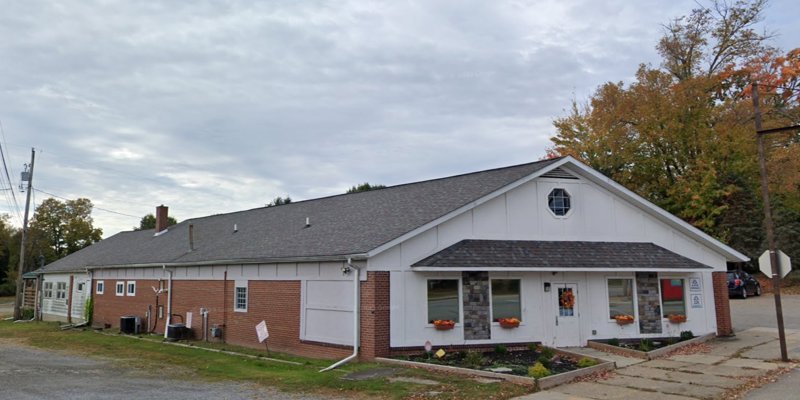 Front view of rehab facility: brick exterior, pitched roof