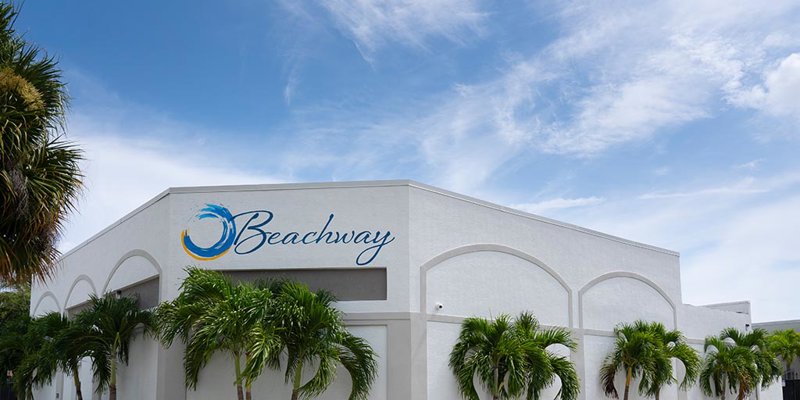 Exterior of Beachway Therapy Center with palm trees