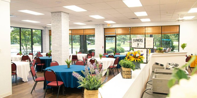 Dining area with tables and chairs.