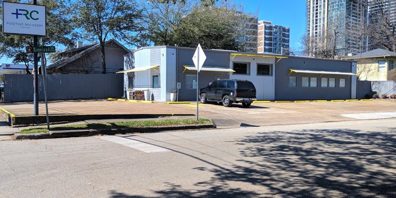 Exterior of Positive Recovery Centers with a parking lot.