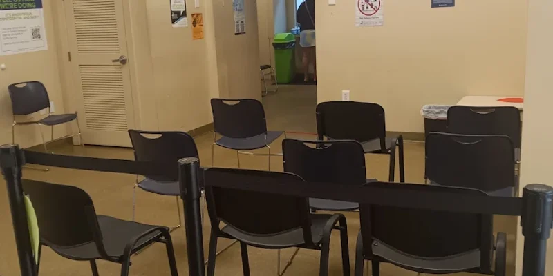 Waiting area with chairs and check-in screens