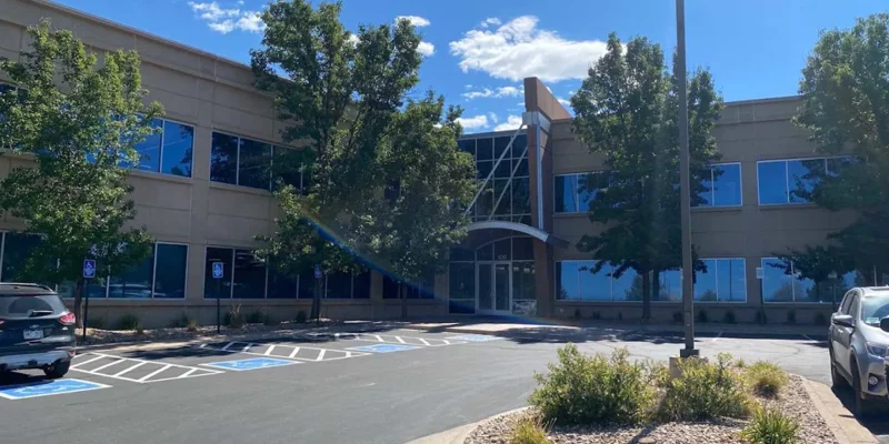 Exterior of a modern two-story building with large windows.