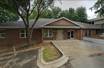 Facility exterior with signage and accessible parking.