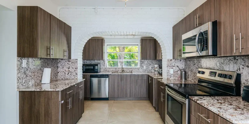 Spacious kitchen with wood cabinets and stainless steel appliances