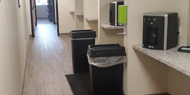 Hallway with coffee stations and service windows.