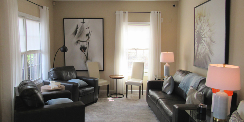 A cozy lounge with leather chairs and soft lighting