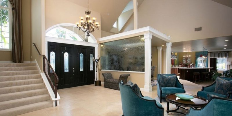 Living area with seating and stairs.