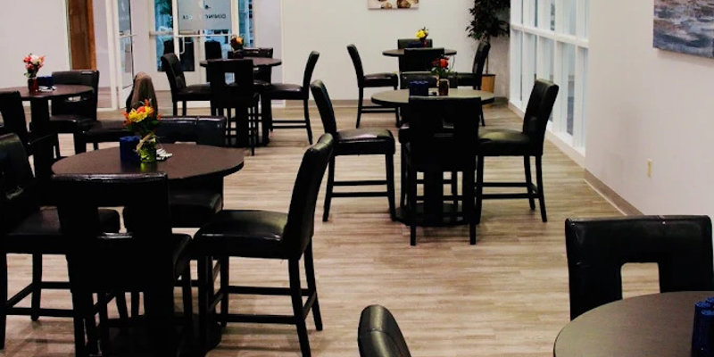 Modern dining area with round tables and black chairs